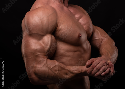 Muscled male model flexing biceps