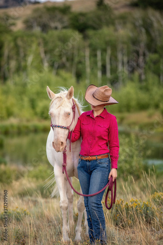 cowgirl with white horse © Terri Cage 
