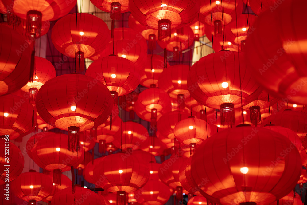 Traditional red lanterns decorated for Chinese new year Chunjie. Cultural festival in Shanghai. Bright Lush lava red background.