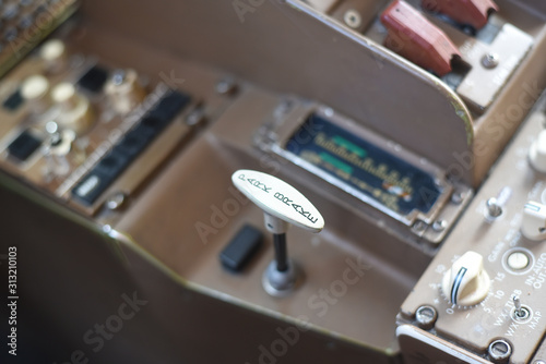 Close up on a parking brake handle on a commercial airplane.