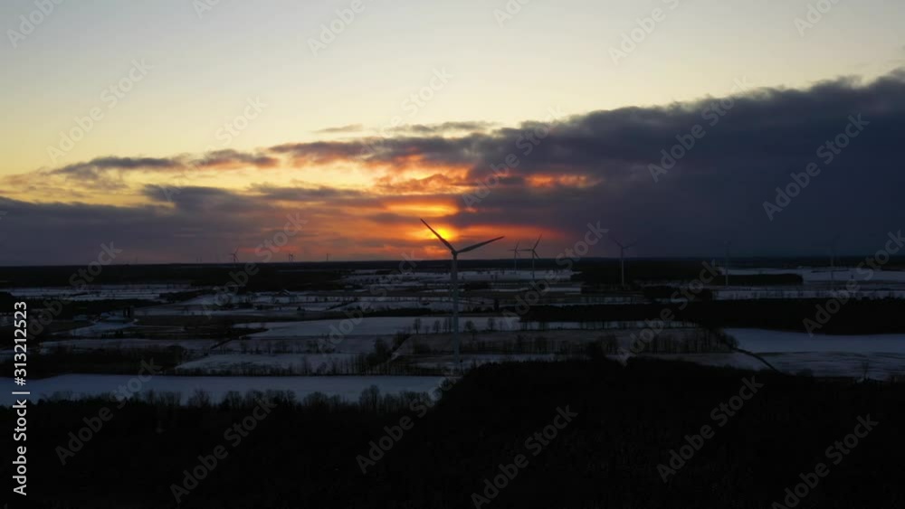 Aerial View of Windmills during Cold Winter Evening Sunset.
Camera Movement: Truck Left Aerial View of Windmills during Cold Winter Evening Sunset.
Camera Movement: Truck Left