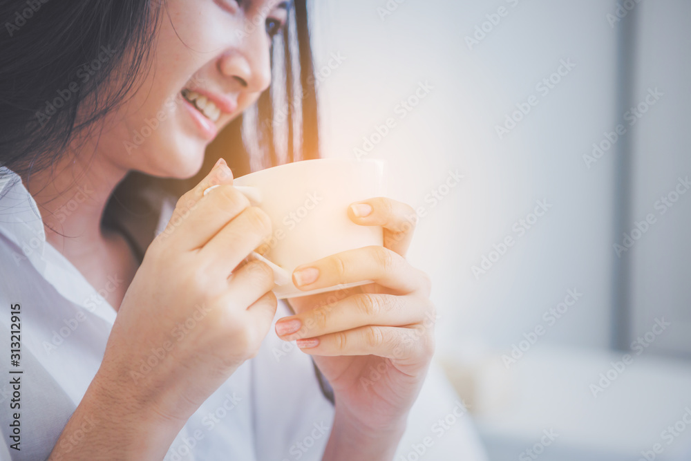 Young woman relaxing in bed at morning Young woman relaxing in bed at morning