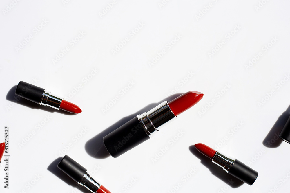 Flat lay composition, Lipsticks on white background with shadow. Beautiful Make-up concept Flat lay composition, Lipsticks on white background with shadow. Beautiful Make-up concept