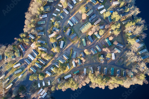 Caravan site park aerial view illuminated by summer sun on Scottish coastal ocean sea island in the highlands Scotland UK photo