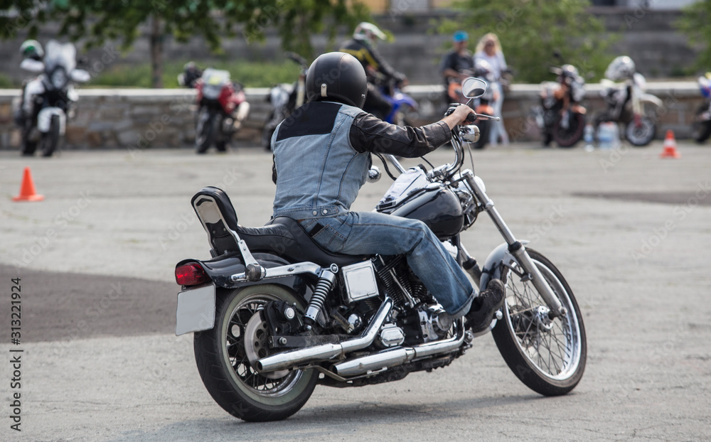 Fototapeta premium Motorcyclist rides a motorcycle