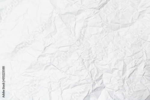 A white crumpled paper texture overlay background