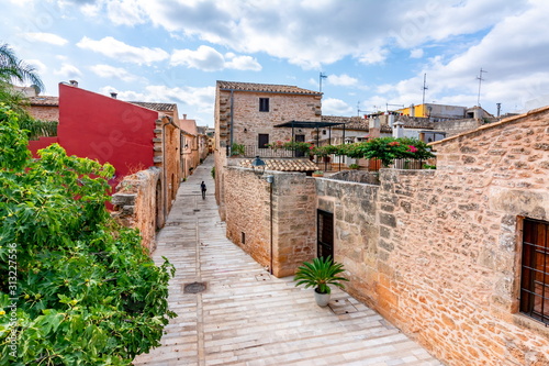 Walls and narrow streets of Alcudia old town, Mallorca, Spain photo