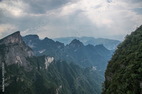  Tianmen Mountain Known as The Heaven s Gate surrounded by the green forest and mist at Zhangjiagie  Hunan Province  China  Asia.