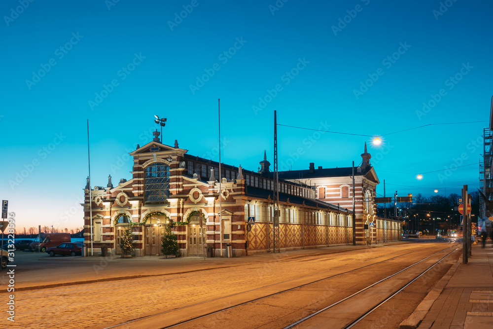 Helsinki, Finland. Old Market Hall Vanha Kauppahalli In City Center In Lighting At Evening Or Night Illumination. Famous Popular Place In Christmas Holiday