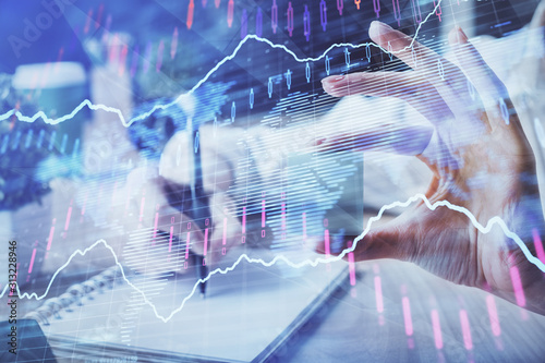 Forex chart displayed on woman's hand taking notes background. Concept of research. Multi exposure