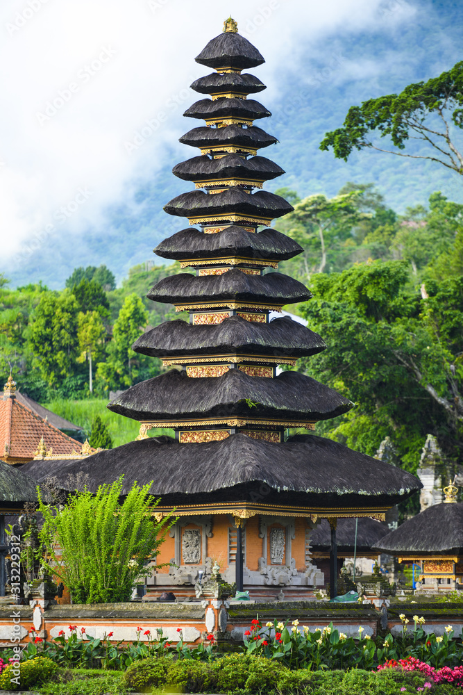 Close-up view of the Pura Ulun Danu Beratan, or Pura Bratan. The temple complex is located on the shores of Lake Bratan and is a major Hindu Shaivite water temple on Bali, Indonesia. Close-up view of the Pura Ulun Danu Beratan, or Pura Bratan. The temple complex is located on the shores of Lake Bratan and is a major Hindu Shaivite water temple on Bali, Indonesia.
