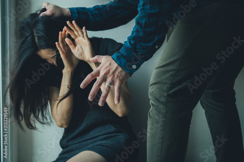 drunk husband hit attacking scared wife in house.help victim of domestic violence, Human trafficking.stop physical abuse women concept
