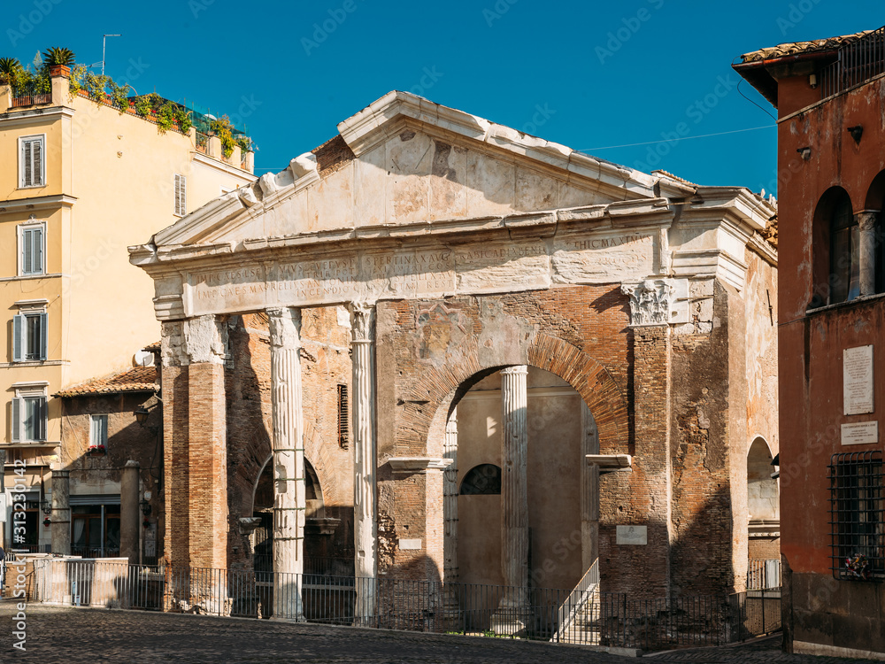 Rome, Italy. Facade Of Ancient Structure Portico Of Octavia In Sunny Day