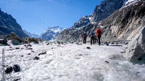 Alpinists walking on the Mer de Glace in the French Alps