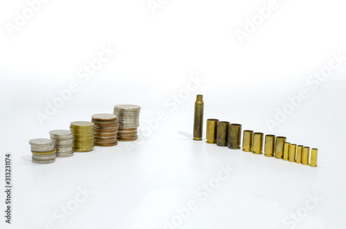 Bullets and coins on a white background