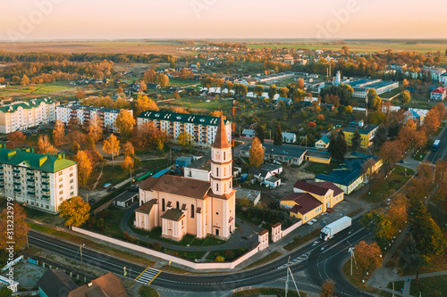 Ruzhany, Brest Region, Belarus. Cityscape Skyline In Autumn Sunny Evening. Bird's-eye View Of And Trinity Church. Famous Historic Landmark