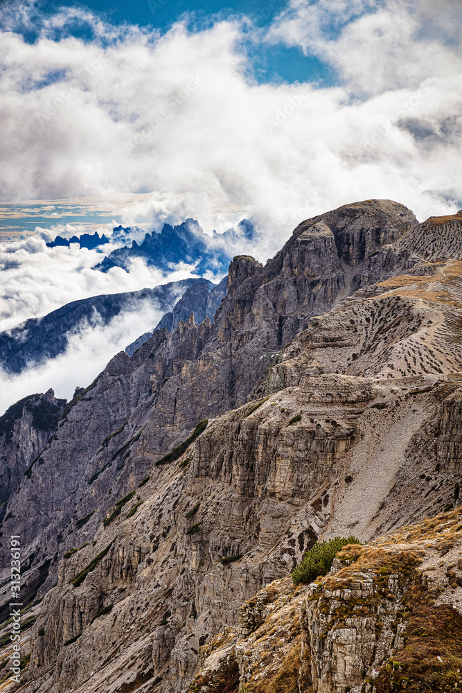 Rocky mountains in Italy with cloudy sky, Dolomites, Tre Cime di Lavaredo