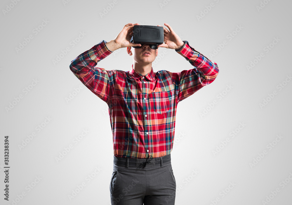 Guy in mask experiencing virtual reality as new entertainment device Guy in mask experiencing virtual reality as new entertainment device