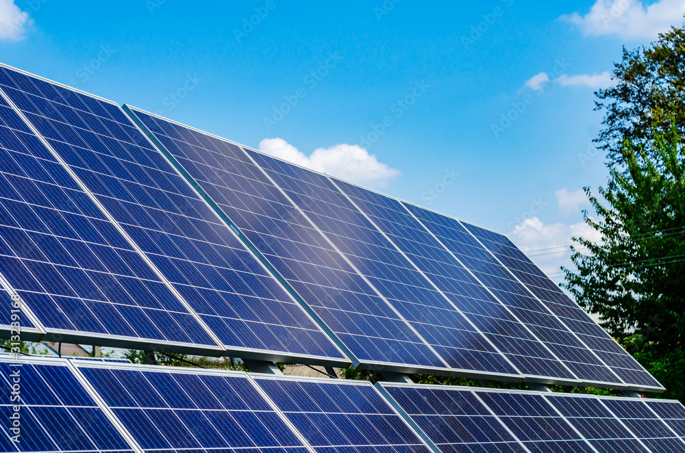 Solar panels on blue sky background Solar panels on blue sky background