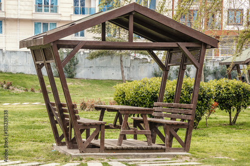summer wooden gazebo for rest and picnic in one of the parks of Istanbul photo
