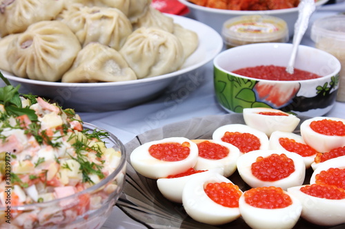 Russian Festive table with seafood and salmon caviar.