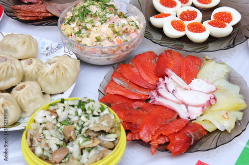 Russian Festive table with seafood and salmon caviar.