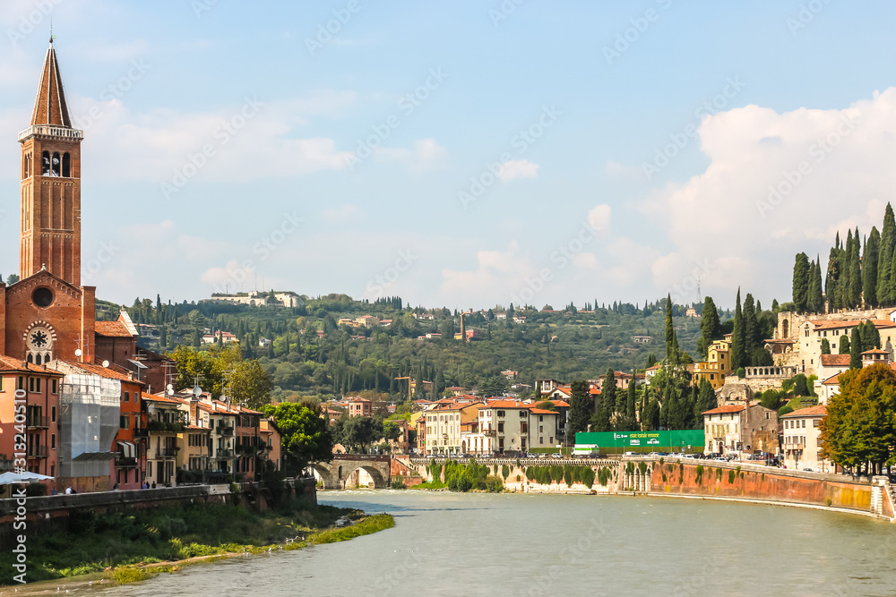 Verona, Italy. View of Adige river embankment in sunny day.