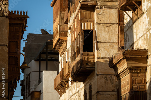 Exterior view of dilapidated traditional residential buildings at the historic district, Al Balad, old city of Jeddah, Saudi Arabia