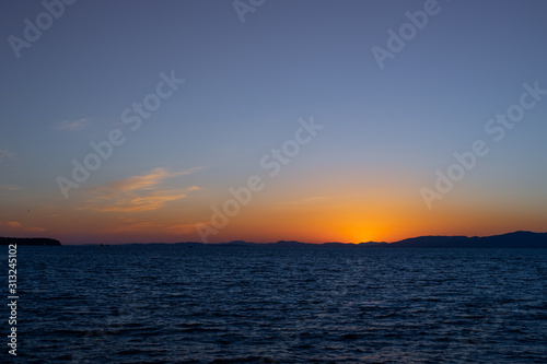 Seascape with sunset on the horizon. Vladivostok, Russia
