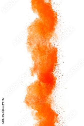 Orange powder explosion isolated on white background.
