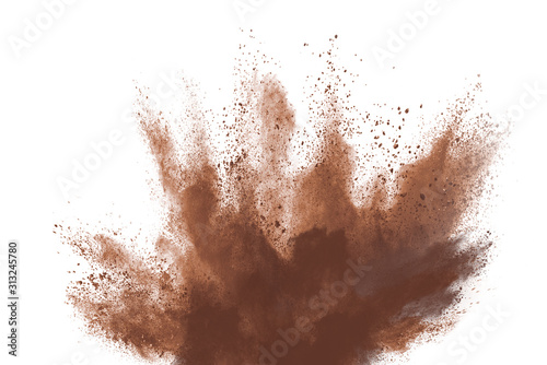 Brown color powder explosion isolated on white background. Colored cloud. Colorful dust explode. Paint Holi.
