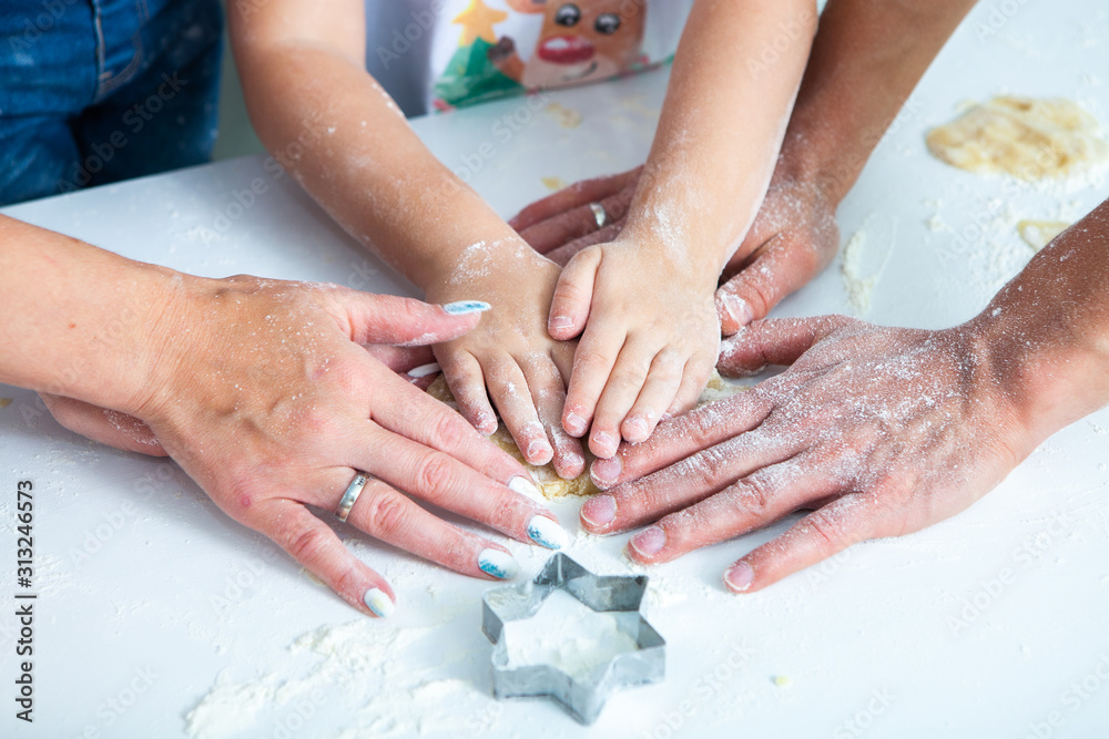 Family cooking homemade cakes. Moms and children hands holding cookie cutters. Family Cooking flat lay. Sweet home. Happiness concept. Family cooking homemade cakes. Moms and children hands holding cookie cutters. Family Cooking flat lay. Sweet home. Happiness concept.