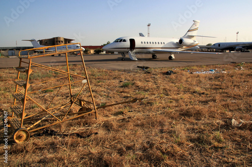 Business Jet surrounded by poverty