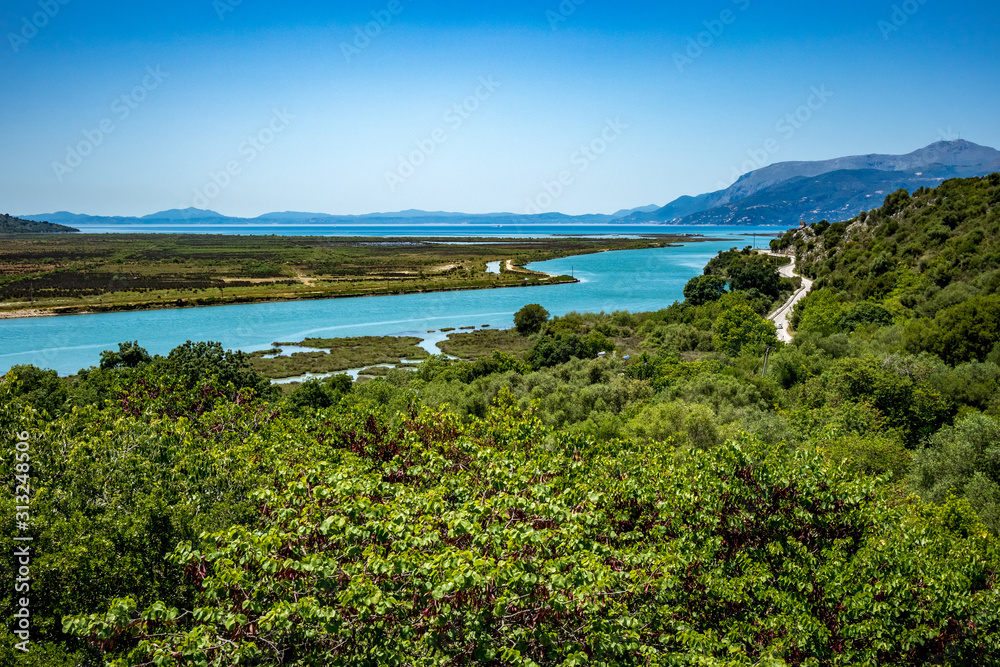 High angle sunny spring day view of salt lagoon lake in the national park of Butrint in Albania, Europe