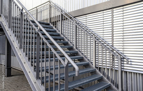Close up view on metallic stairs at a modern architecture building photo