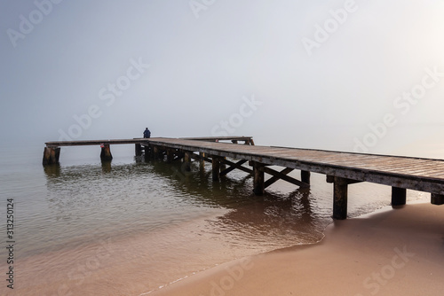 Wooden jetty by the sea during the morning fog. Baltic Sea  Sopot Poland