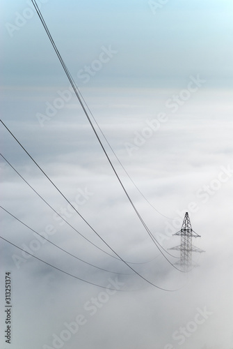 Power lines going into the fog
