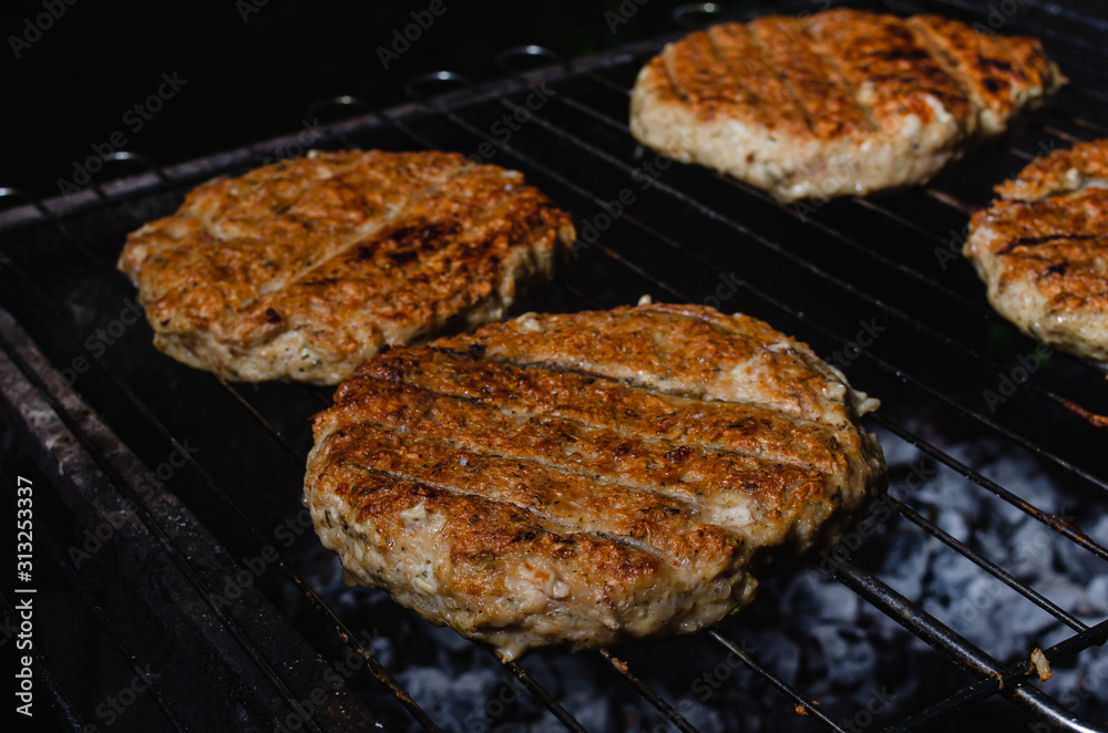 chicken burger composition on a bbq grill chicken burger composition on a bbq grill