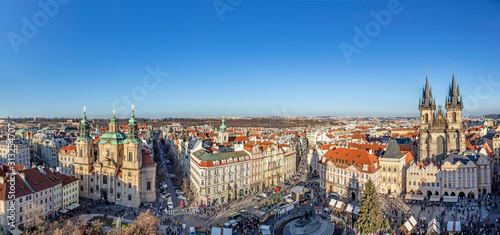 Old Town of Prague, Czech Republic. View on Tyn Church and Jan Hus Memorial on the square as seen from Old Town City Hall during Christmas market.