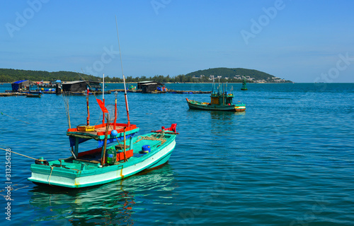 Fishing boats on the blue sea © Phuong