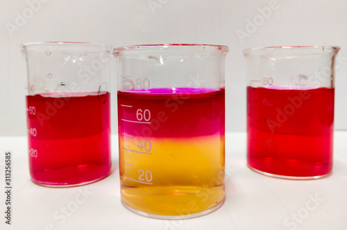 TWO PHASES OF LIQUID IN BEAKER