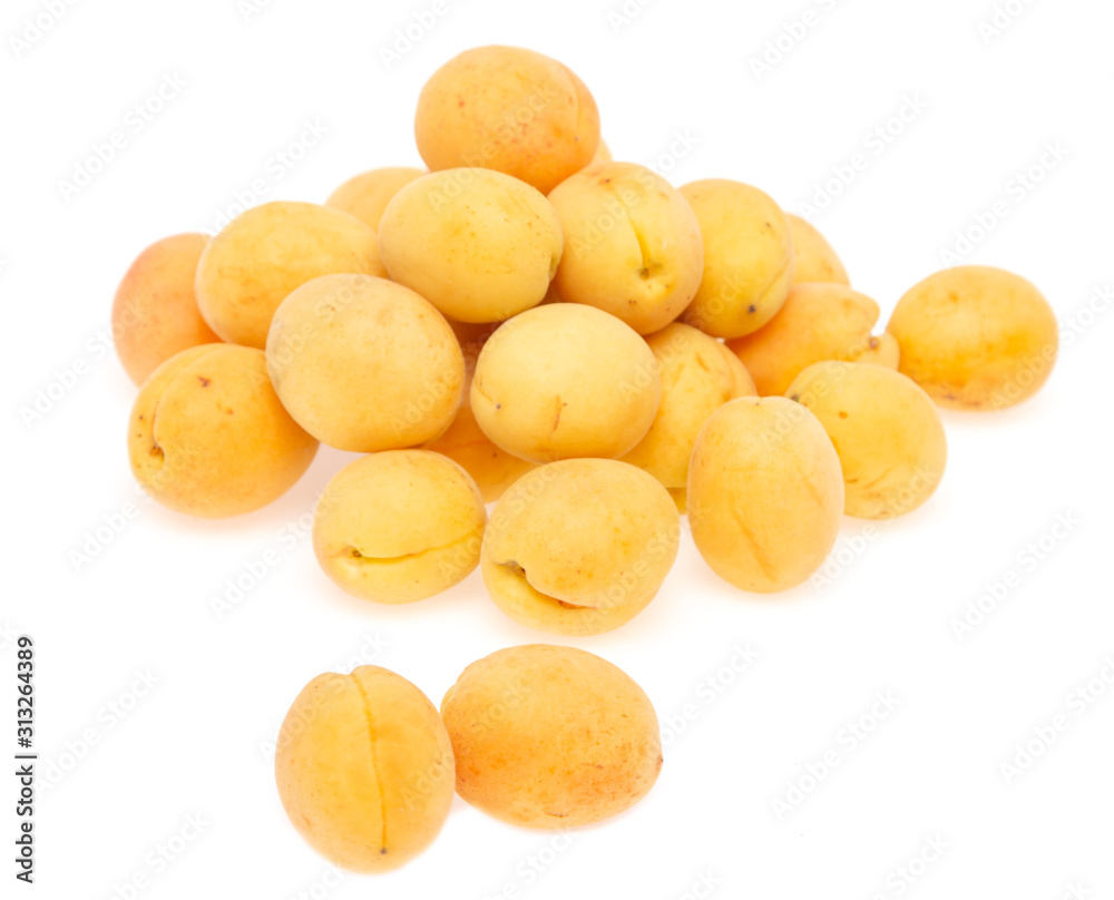 fresh yellow apricots against white background