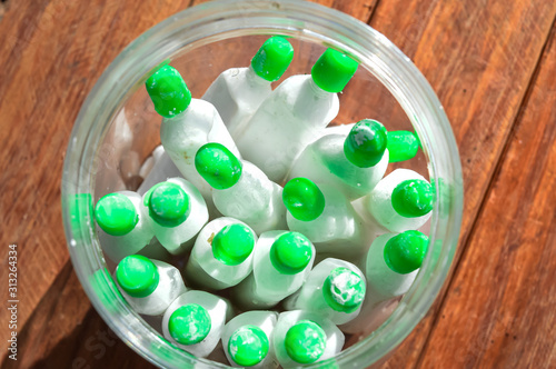 soya milk bottle,Limestone,Limestone Powder, Chuna Powder in White Bowl on Wooden background, Lime Chuna,indian tobacco chuna, photo