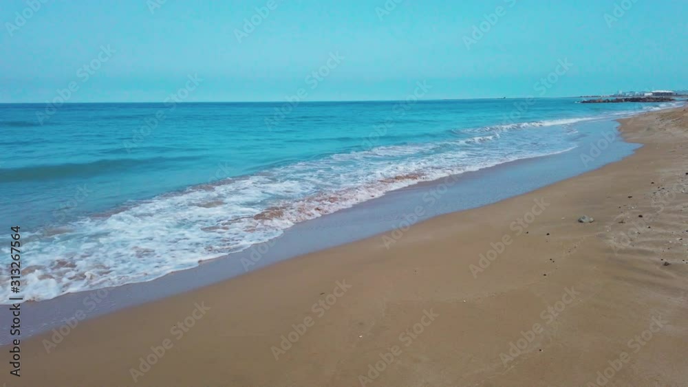 Beach landscape, waves crashing empty beach, Dubai, United Arab Emirates Beach landscape, waves crashing empty beach, Dubai, United Arab Emirates