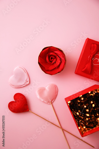 A paper red rose flower in a gift box.