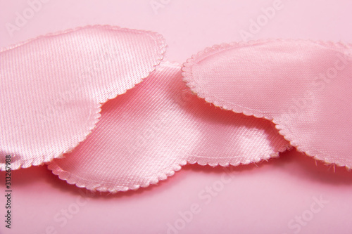 Tiny pink hearts made of clothes.
