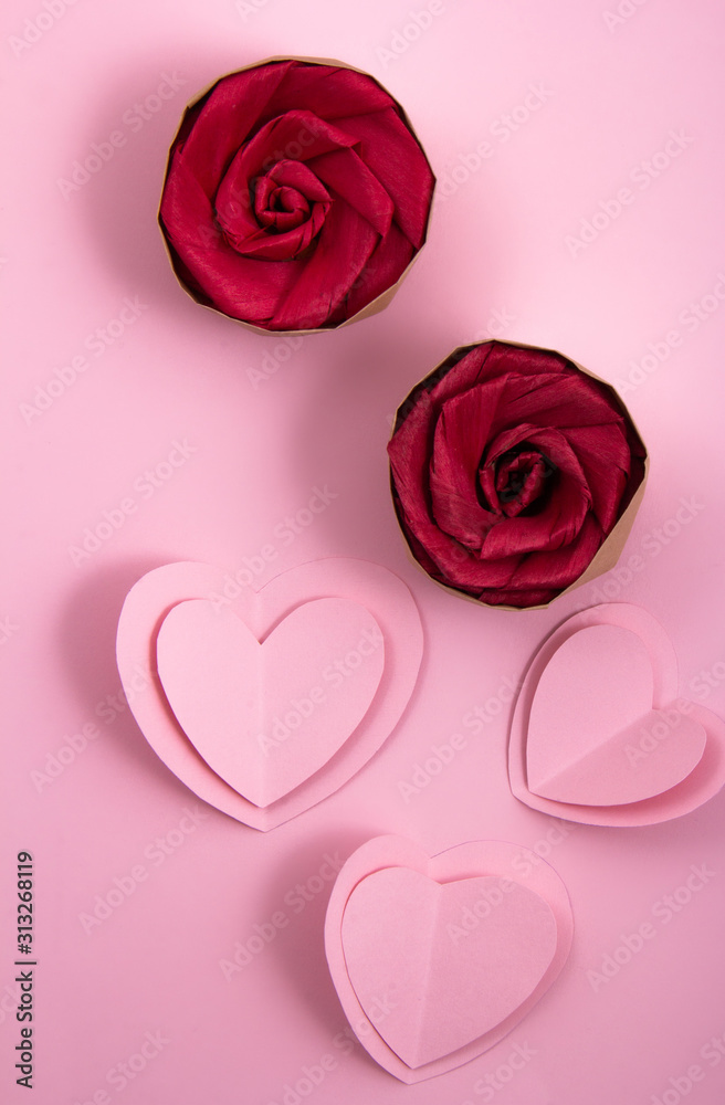 Paper hearts and rose flowers.