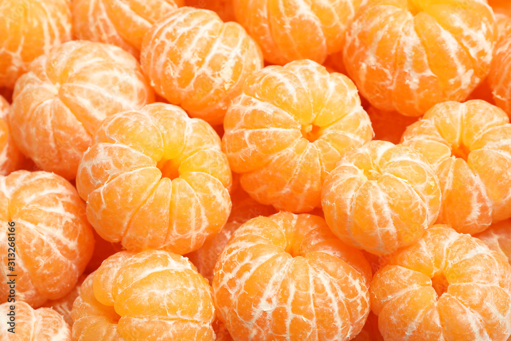 Peeled fresh ripe tangerines as background, closeup Peeled fresh ripe tangerines as background, closeup