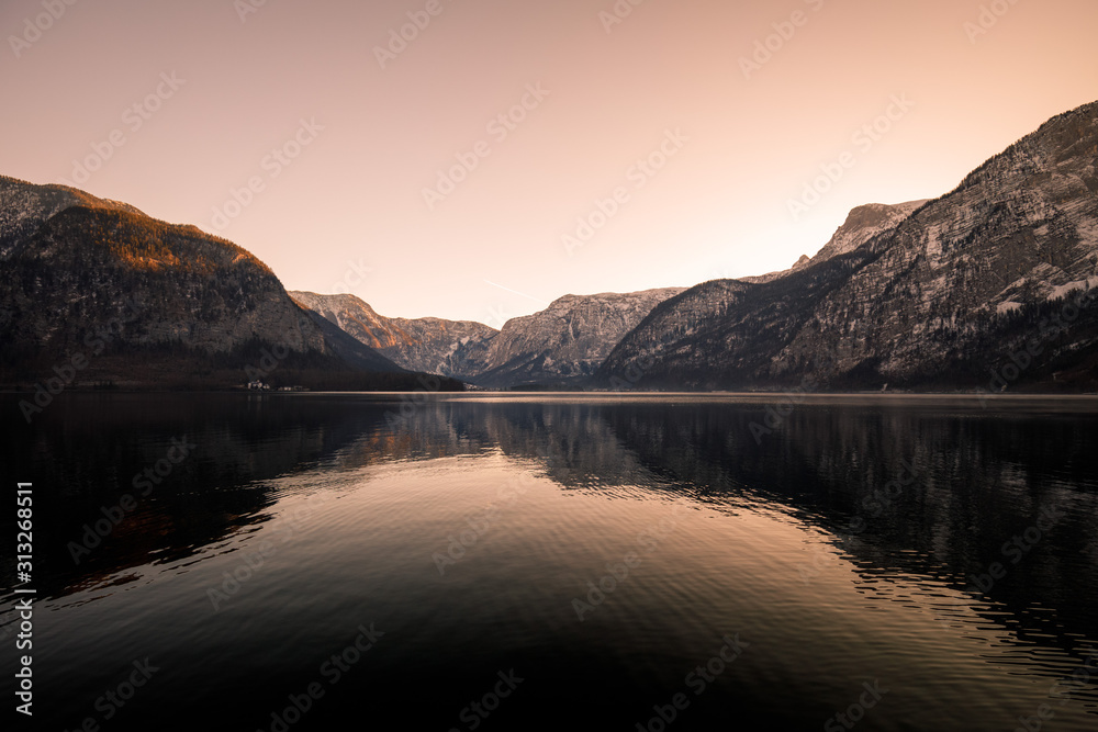 Hallstatt Mountain Lake in Winter. Beautiful scenery of winter mountains reflected in lake in austria
