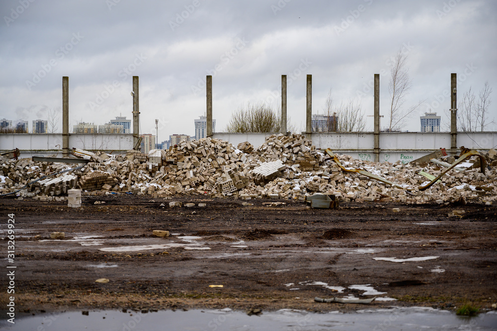 The concept of trash environmental disaster. Photo of a landfill on a street in a city on a cloudy day. The concept of trash environmental disaster. Photo of a landfill on a street in a city on a cloudy day.